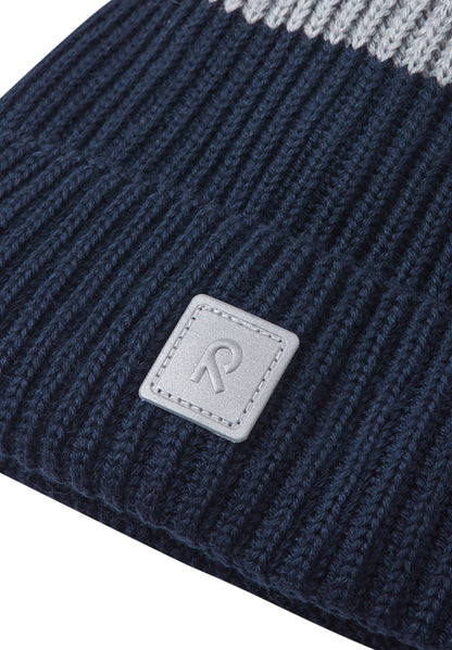 REIMA Mütze<br>Pilke <br>Gr. 48/50, 52/54 <br>eingenähtes reflektierendes Garn <br>innen hautfreundliches Fleece<br> aussen warmer, wasserabweisender Woll-Mix<br> Windstopper-Membrane im Ohrbereich